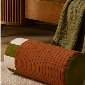 Sovana velvet neck-roll pillow in Rust Lime in a contemporary interior