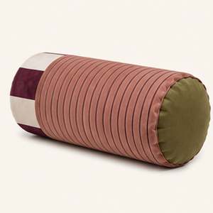 Sovana velvet neck-roll pillow in Rose Plum on a cream background