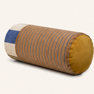 Sovana velvet neck-roll pillow in Sand Sky on a cream background