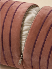 Close detail of the Sovana velvet neck-roll pillow removable zipped cover