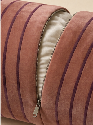 Close detail of the Sovana velvet neck-roll pillow removable zipped cover